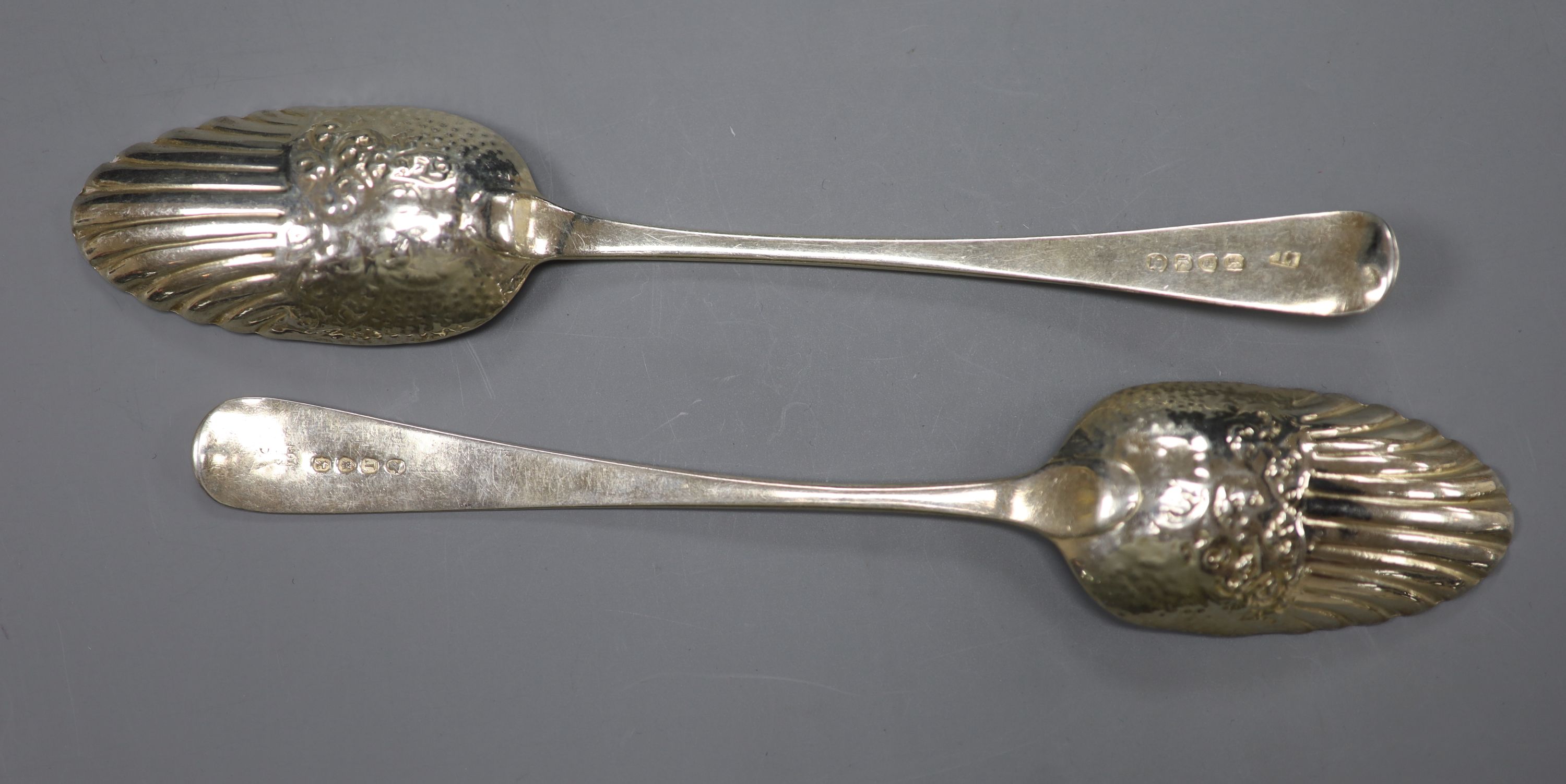Two similar George III silver berry spoons, London, 1805 & 1814 and a cased set of six silver coffee spoons.